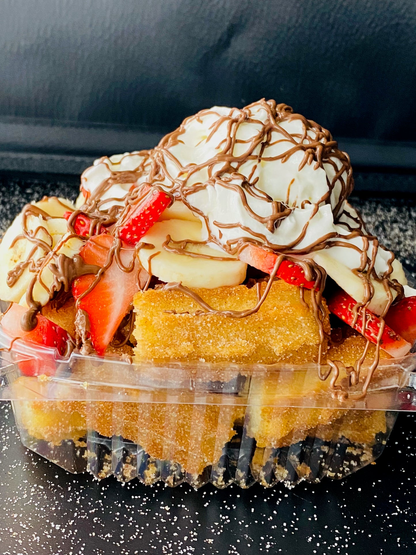 #5 Churro Bites topped with fresh Strawberries, Banana, Nutella & Whipped Cream