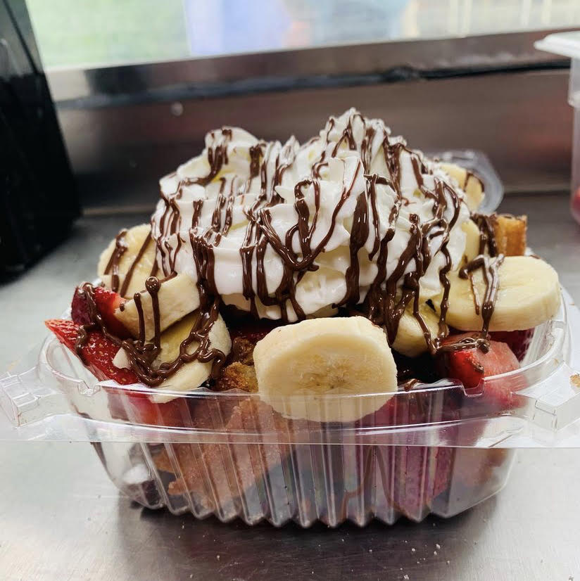#5 Churro Bites topped with fresh Strawberries, Banana, Nutella & Whipped Cream